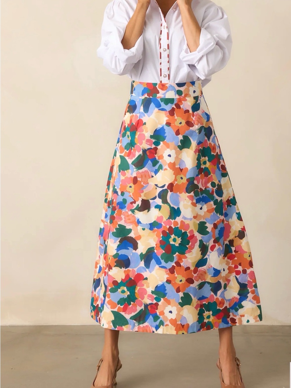 Prosperina River Orange Midi Skirt in a vibrant orange multi-floral print